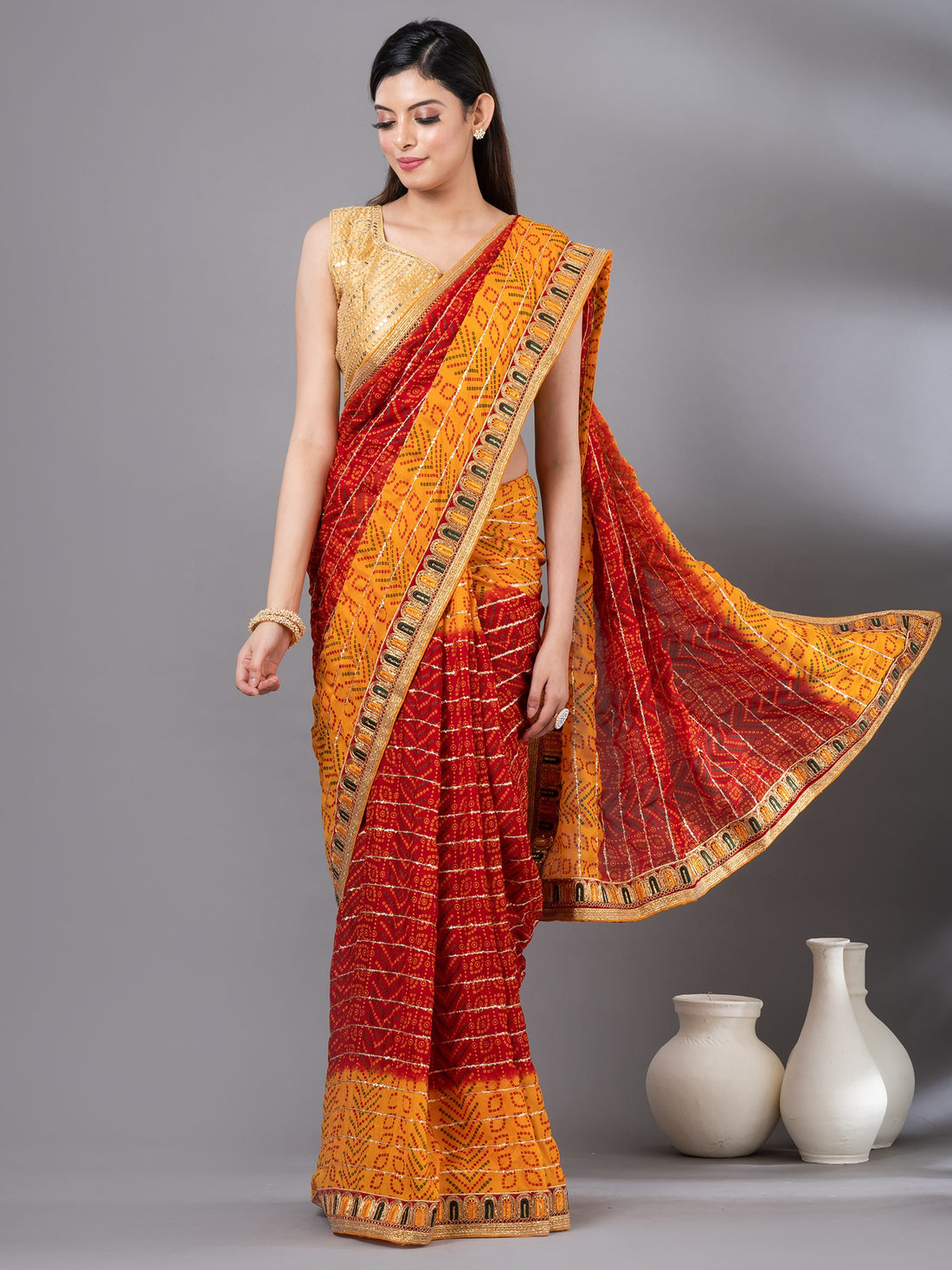 Pretty red georgette Mahalasa bandhani Saree, It has striped pattern work all over the saree and comes with small Embroidered border