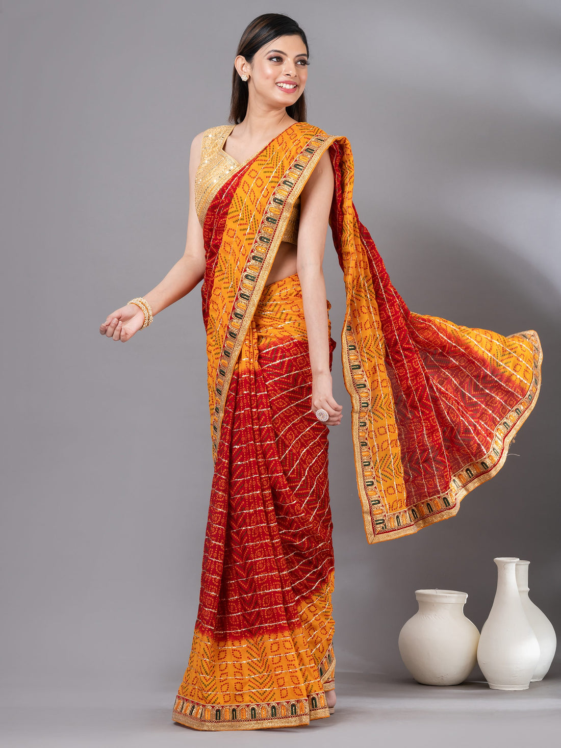 Pretty red georgette Mahalasa bandhani Saree, It has striped pattern work all over the saree and comes with small Embroidered border